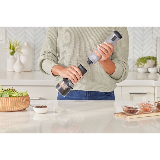 Photo of BLACKDECKER electric pepper grinder BCKM1016KSG being used in a modern kitchen.