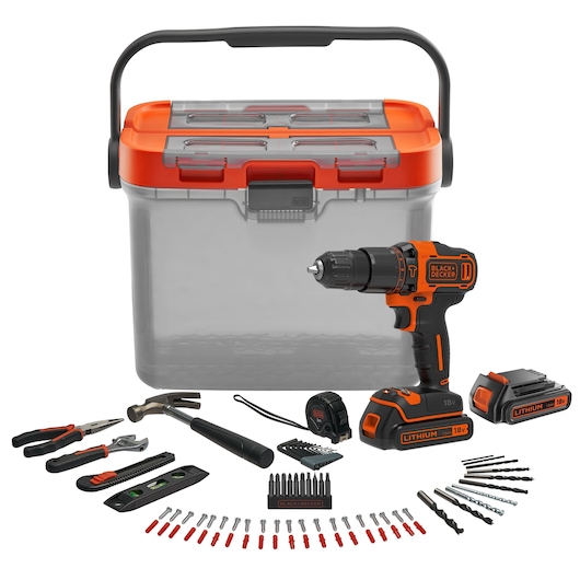 BLACK+DECKER tool kit including a transparent plastic storage box with an orange lid, an 18V cordless drill, an extra battery, a hammer, pliers, a wrench, a tape measure, a utility knife, a level, multiple drill bits, screw bits, and other accessories arranged neatly.