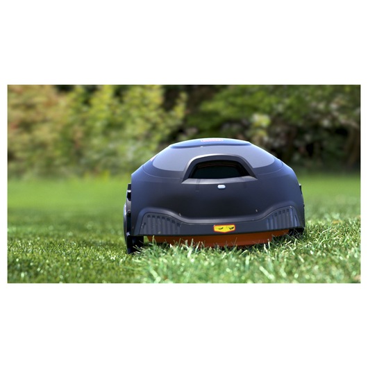 BLACKDECKER BCRMW121 robotic lawn mower in black on grass, rear view.