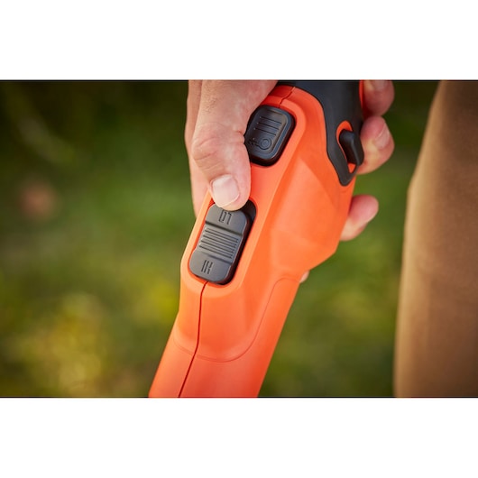 Photo of BLACKDECKER BCSTE636L1 orange power tool handle with close-up of speed control switches.