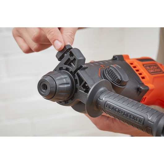 Photo of BLACK+DECKER BEHS01K hammer drill close-up showing adjustable depth gauge and side handle.