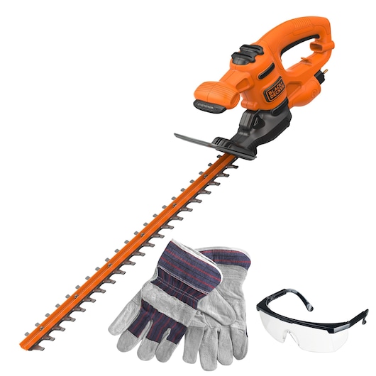 Orange and black BLACK+DECKER electric hedge trimmer with a pair of protective gloves and clear safety glasses shown on a white background.