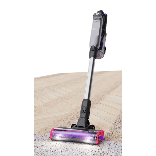 BLACKDECKER BHFEA640WP cordless stick vacuum cleaner with LED lights, silver and black, cleaning hard floor, front angle.