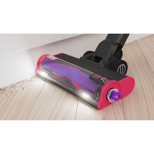 BLACKDECKER BHFEA640WP vacuum cleaner head with LED lights cleaning floor, close-up angle.