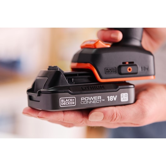 BLACK+DECKER BLD683D1 lithium 18V 2.0Ah Power Connect battery held in hand, close-up view.