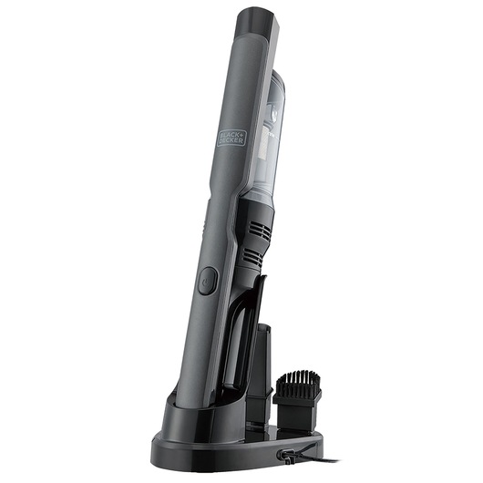 A BLACK+DECKER handheld cordless vacuum cleaner in a charging dock, shown upright with an accessory attached. The device is sleek, dark gray in color, and features a transparent dust container.